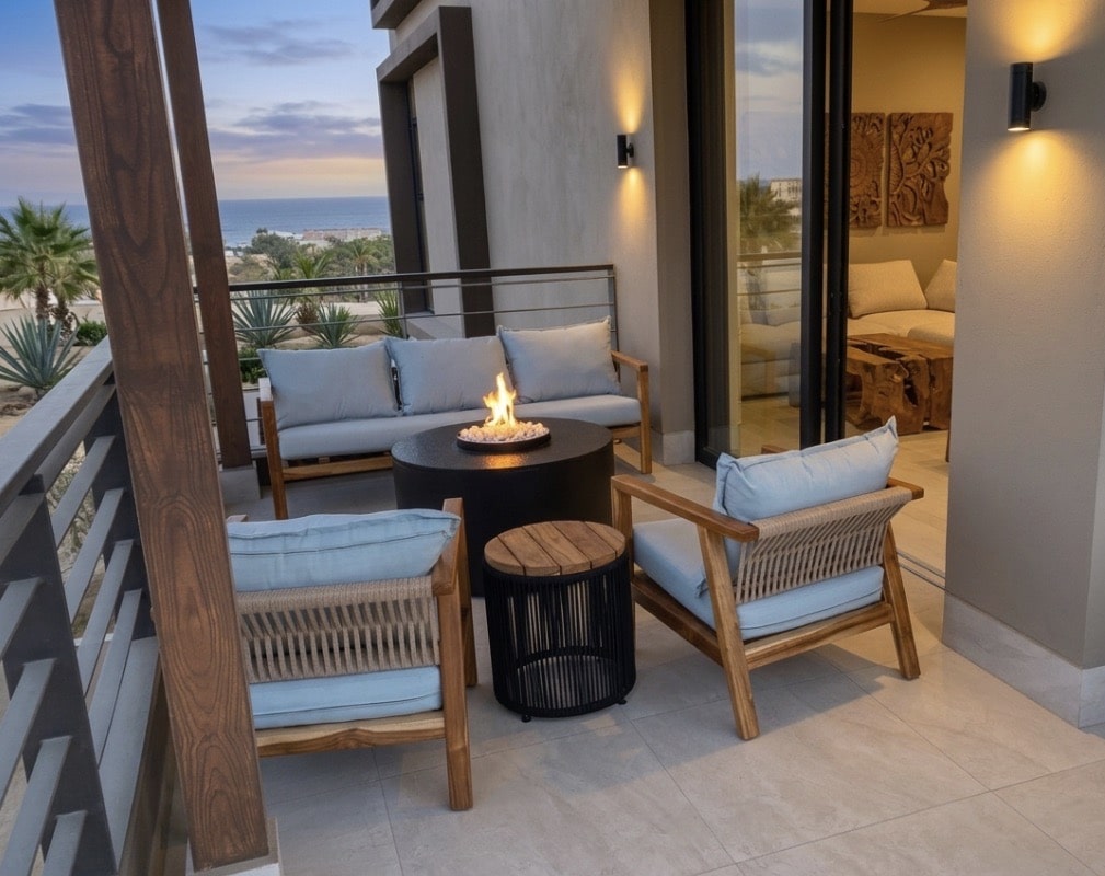 Custom Teak wood outdoor furniture and firepit on a patio at Wen Living Cabo